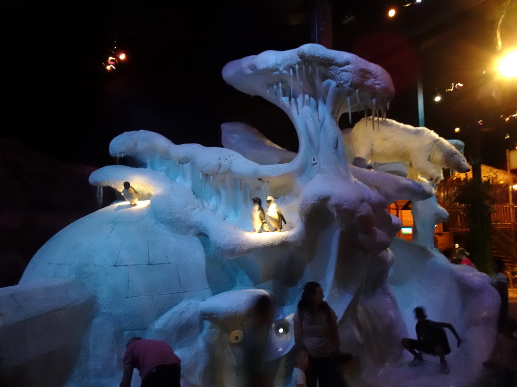 Slide with penguin statues at the playground of the Octopus restaurant at the Anderrijk kingdom