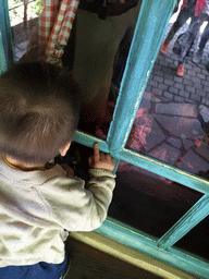 Max in front of Geppetto`s House at the Pinocchio attraction at the Fairytale Forest at the Marerijk kingdom