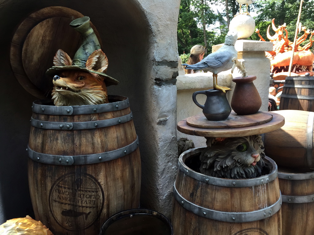 Wooden barrels, fox, cat and bird at the Pinocchio attraction at the Fairytale Forest at the Marerijk kingdom