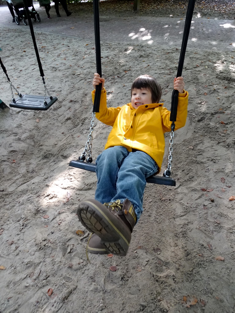 Max on a swing at the Kindervreugd playground at the Marerijk kingdom