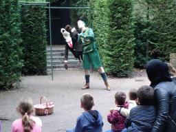 Actor with hand puppet during the Sprookjesboom Show at the Open-air Theatre at the Fairytale Forest at the Marerijk kingdom