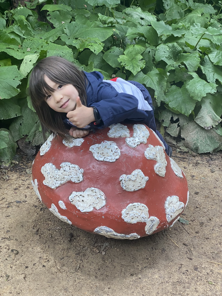 Max on a mushroom statue at the Fairytale Forest at the Marerijk kingdom