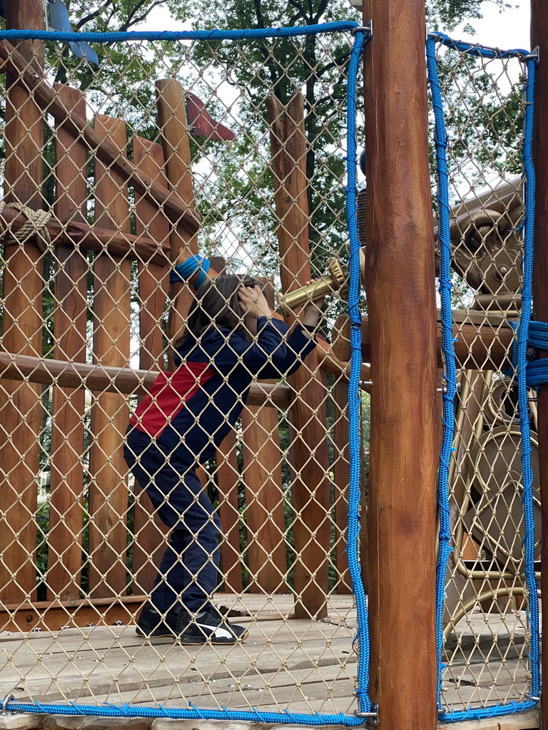 Max with a telescope at the Nest! play forest at the Ruigrijk kingdom