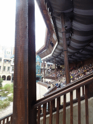 Actor coming down from the ceiling of the grandstand to the stage of the Raveleijn theatre at the Marerijk kingdom, during the Raveleijn Parkshow