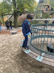 Max on a swing at the Kindervreugd playground at the Marerijk kingdom