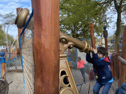 Max with a telescope at the Nest! play forest at the Ruigrijk kingdom