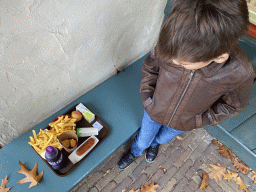 Max with lunch at the terrace of the Smulpaap restaurant at the Anton Pieck Plein square at the Marerijk kingdom