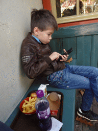 Max having lunch at the terrace of the Smulpaap restaurant at the Anton Pieck Plein square at the Marerijk kingdom