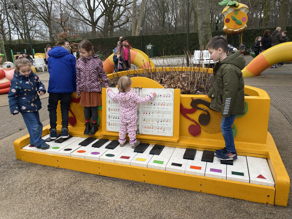 Max on a piano at the Kleuterhof playground at the Reizenrijk kingdom