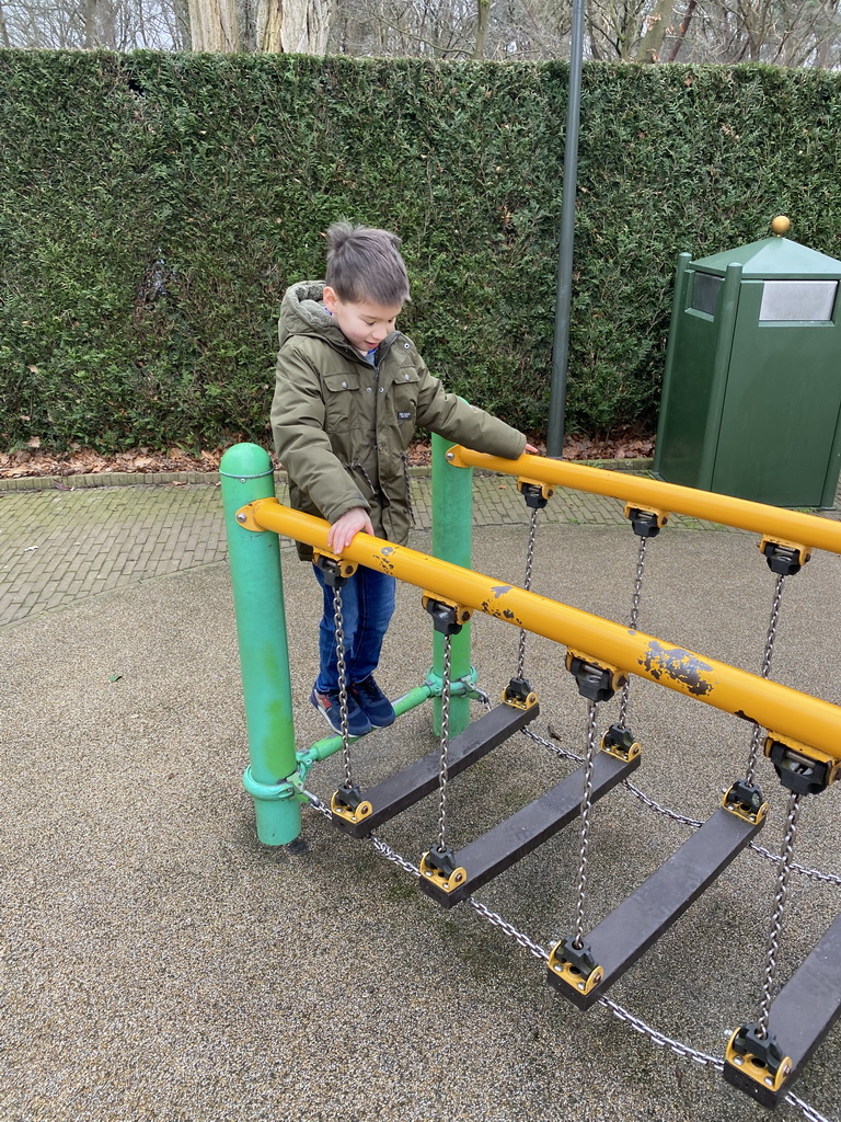 Max on the bridge at the Kleuterhof playground at the Reizenrijk kingdom
