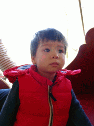 Max at the carrousel at the Anton Pieck Plein square at the Marerijk kingdom