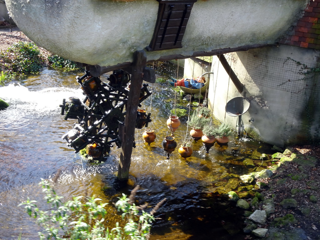 Water wheel at the Lal`s Brouwhuys building at the Laafland attraction at the Marerijk kingdom, viewed from the monorail