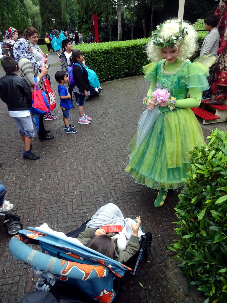 Max with an actress dressed like a fairy at the square near the entrance of the Efteling theme park