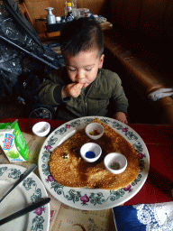 Max having a pancake at the Polles Keuken restaurant at the Fantasierijk kingdom