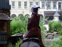 Actor and horse on the stage of the Raveleijn theatre at the Marerijk kingdom, during the Raveleijn Parkshow