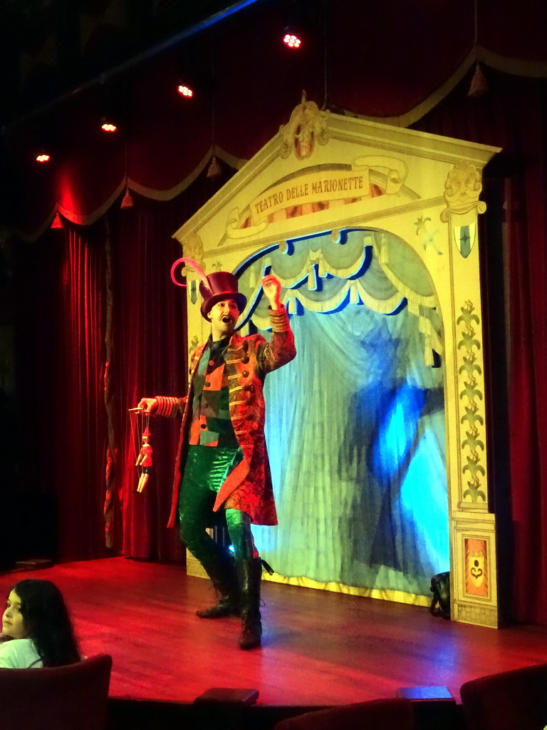 Show performer with a marionette at Pinokkio`s restaurant at the Fantasierijk kingdom