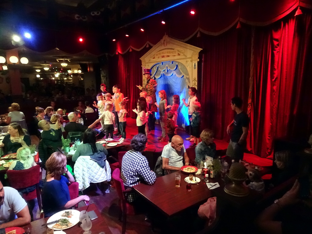 Show performers and children at Pinokkio`s restaurant at the Fantasierijk kingdom