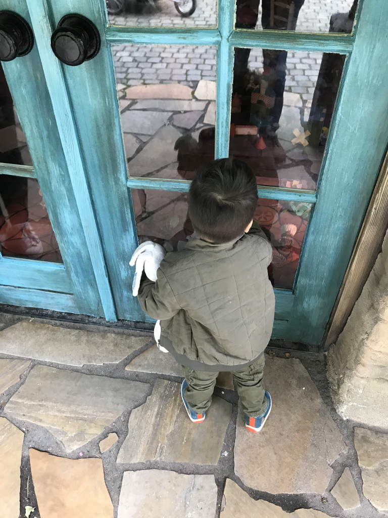 Max in front of Geppetto`s House at the Pinocchio attraction at the Fairytale Forest at the Marerijk kingdom