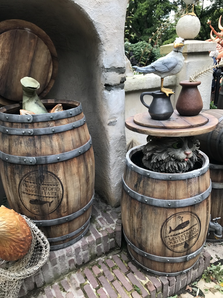 Wooden barrels, fox, cat and bird at the Pinocchio attraction at the Fairytale Forest at the Marerijk kingdom