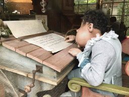 Laaf writing in the Leerhuys building at the Laafland attraction at the Marerijk kingdom