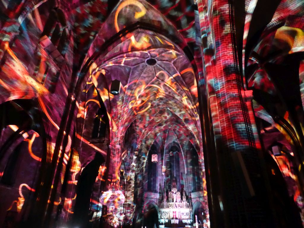 Nave and apse of the Augustijnenkerk church during the Casa Magica lightshow of the GLOW festival