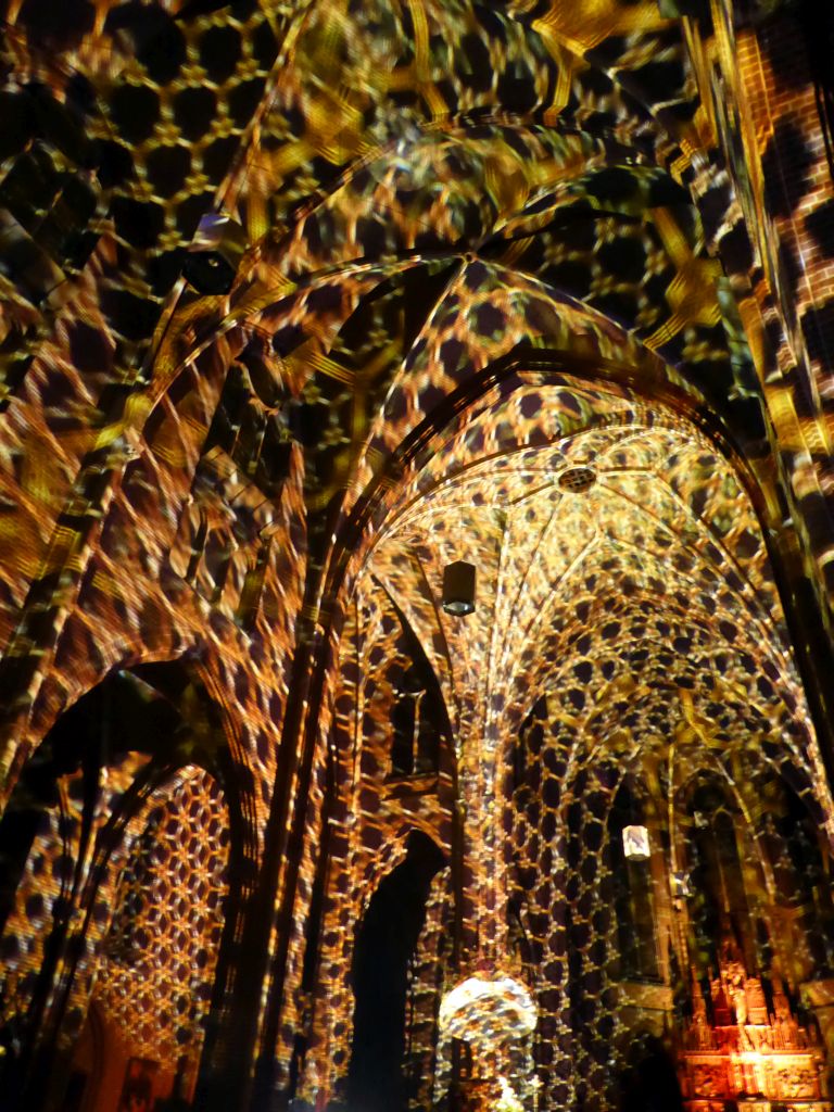 Nave and apse of the Augustijnenkerk church during the Casa Magica lightshow of the GLOW festival