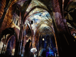 Nave and apse of the Augustijnenkerk church during the Casa Magica lightshow of the GLOW festival