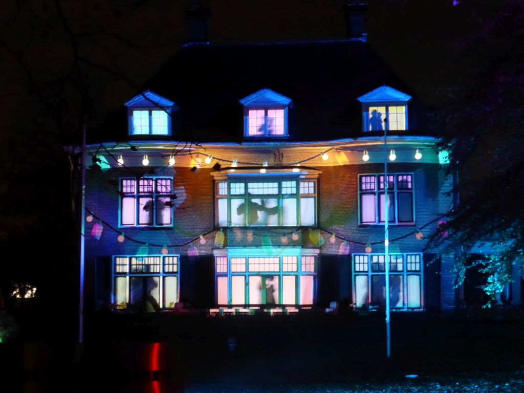 Light show `Parklaan Flashback` on the Villa Wijers building at the Parklaan street during the GLOW festival, by night