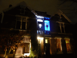 Light panels in front of a house during the light show `Merellaan Glows` at the Merellaan street during the GLOW festival, by night