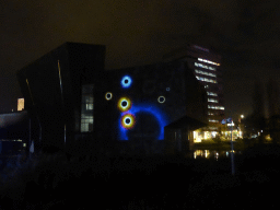 Projection `Innocent Body` on the southeast side of the Van Abbemuseum during the GLOW festival, viewed from the Stratumsedijk street, by night