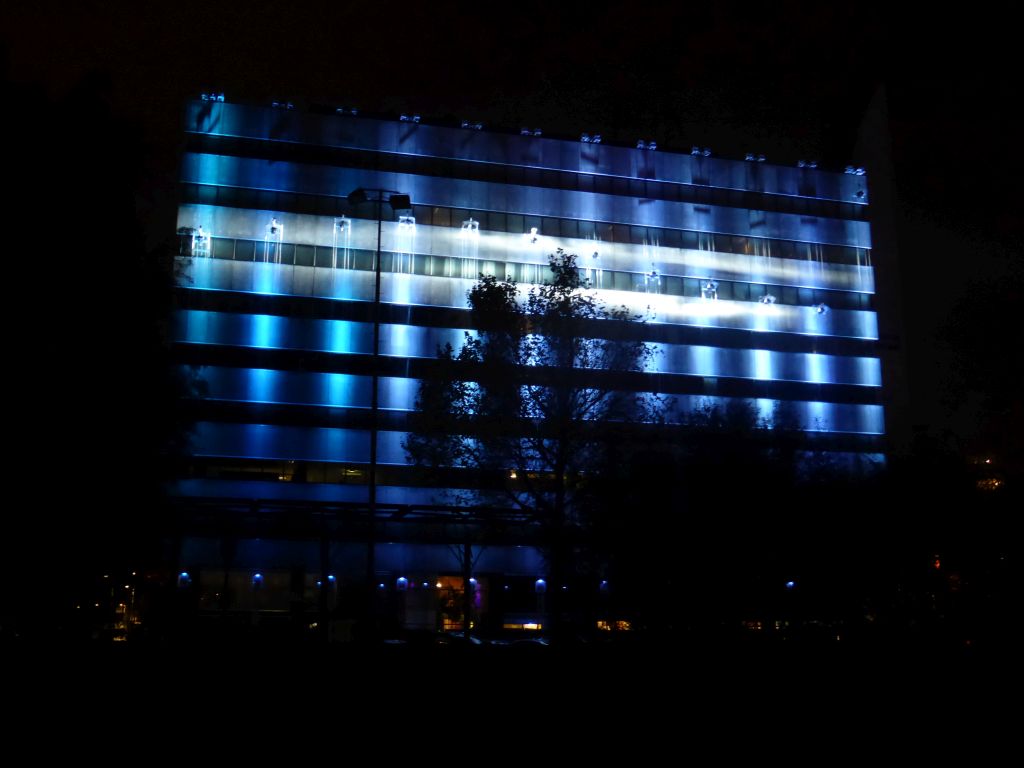 Light sculpture `Statemachine` on the DELA building during the GLOW festival, viewed from the Bleekweg street, by night