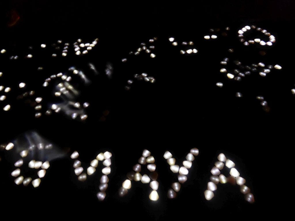 Light text at the inner square of the Natlab building during the GLOW-NEXT festival, by night