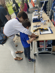 Miaomiao and Max playing with a robot arm at the Strip area at the High Tech Campus Eindhoven, during the High Tech Campus Eindhoven Open Day 2022