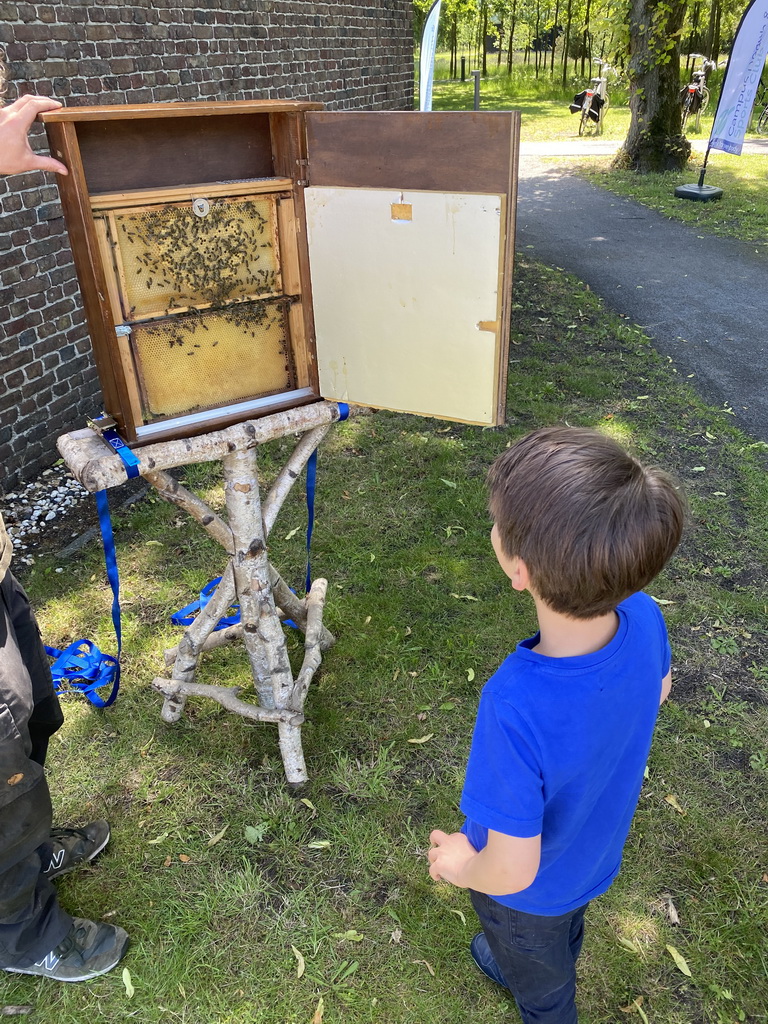 Max with a beehive in front of the Boerderij building at the High Tech Campus Eindhoven, during the High Tech Campus Eindhoven Open Day 2022