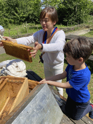 Miaomiao and Max with a beehive in front of the Boerderij building at the High Tech Campus Eindhoven, during the High Tech Campus Eindhoven Open Day 2022