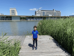Max on a pier at the pond at the High Tech Campus Eindhoven, with a view on the Strip area and buildings HTC33 and HTC34, during the High Tech Campus Eindhoven Open Day 2022