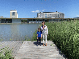 Miaomiao and Max on a pier at the pond at the High Tech Campus Eindhoven, with a view on the Strip area and buildings HTC33 and HTC34, during the High Tech Campus Eindhoven Open Day 2022