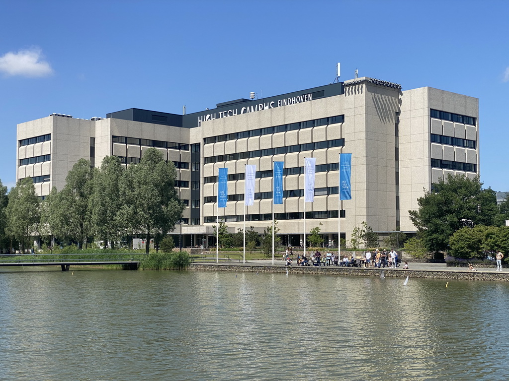 People playing with remote controlled boats at the pond and building HTC5 at the High Tech Campus Eindhoven, during the High Tech Campus Eindhoven Open Day 2022