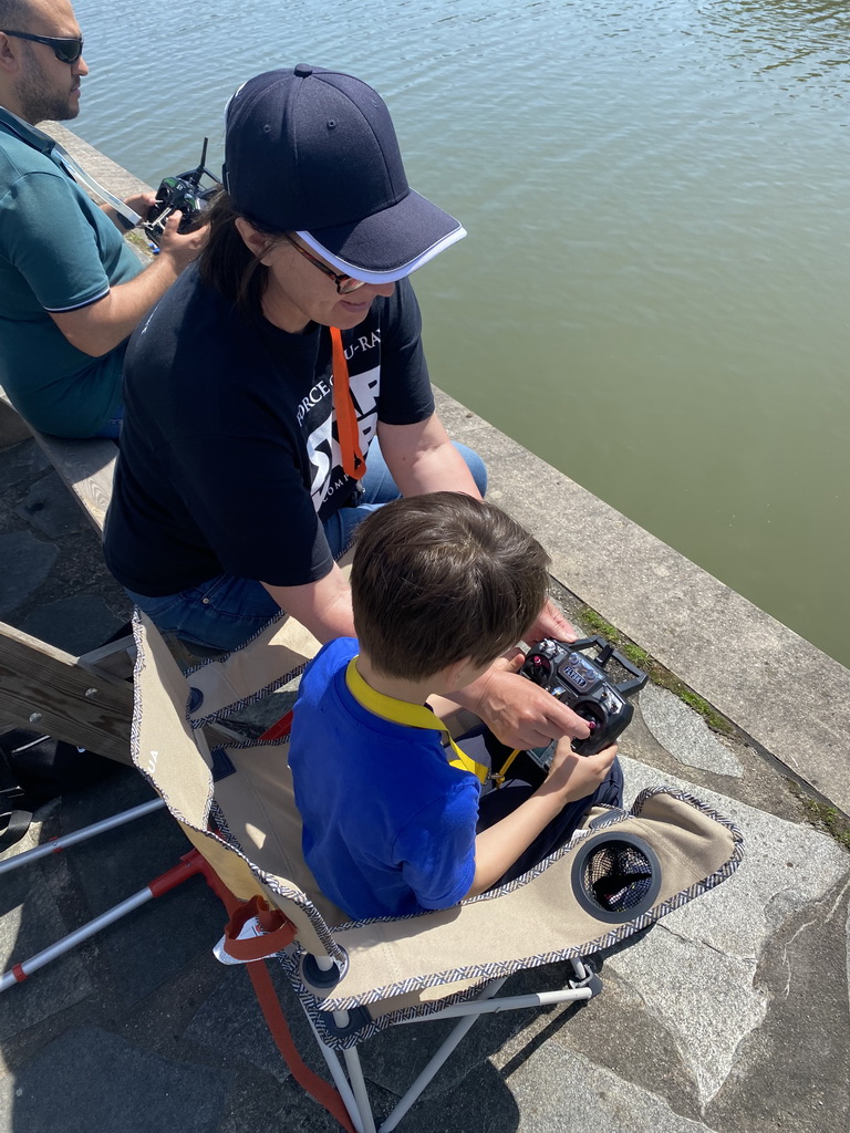 Max playing with a remote controlled boat at the pond at the High Tech Campus Eindhoven, during the High Tech Campus Eindhoven Open Day 2022