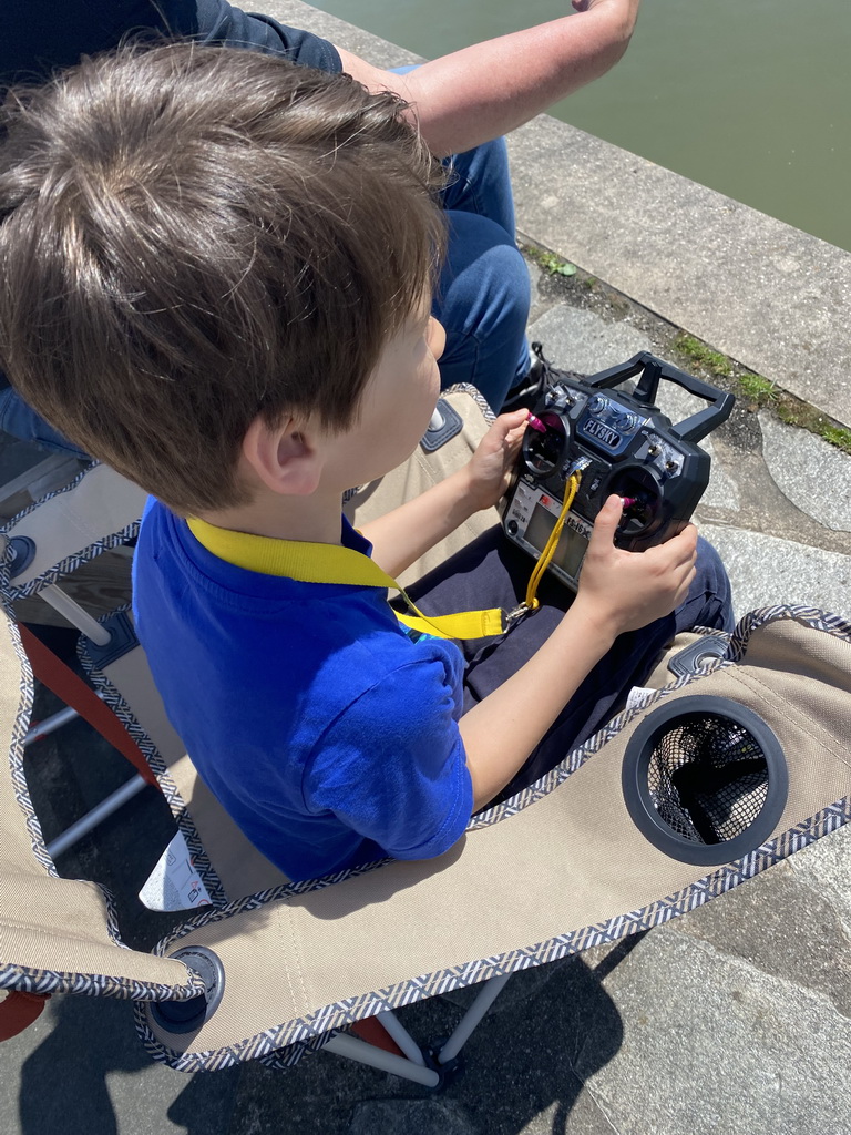 Max playing with a remote controlled boat at the pond at the High Tech Campus Eindhoven, during the High Tech Campus Eindhoven Open Day 2022