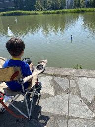 Max playing with a remote controlled boat at the pond at the High Tech Campus Eindhoven, during the High Tech Campus Eindhoven Open Day 2022