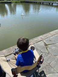 Max playing with a remote controlled boat at the pond at the High Tech Campus Eindhoven, during the High Tech Campus Eindhoven Open Day 2022