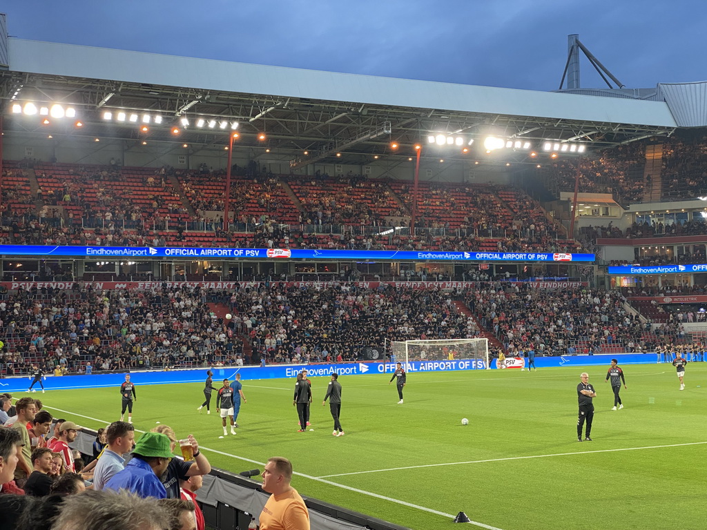 PSV players on the pitch at the Philips Stadium, viewed from the Eretribune Noord grandstand, just before the football match PSV - NEC