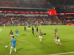 NEC players on the pitch at the Philips Stadium, viewed from the Eretribune Noord grandstand, just before the football match PSV - NEC