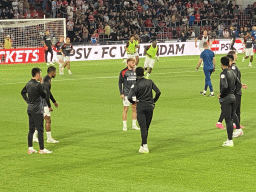 PSV players on the pitch at the Philips Stadium, viewed from the Eretribune Noord grandstand, just before the football match PSV - NEC