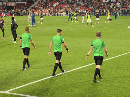 Referees and PSV players on the pitch at the Philips Stadium, viewed from the Eretribune Noord grandstand, just before the football match PSV - NEC