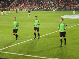 Referees and PSV players on the pitch at the Philips Stadium, viewed from the Eretribune Noord grandstand, just before the football match PSV - NEC