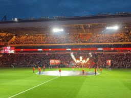 Referees and players entering the pitch at the Philips Stadium, viewed from the Eretribune Noord grandstand, just before the football match PSV - NEC
