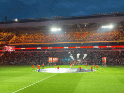 Referees and players entering the pitch at the Philips Stadium, viewed from the Eretribune Noord grandstand, just before the football match PSV - NEC