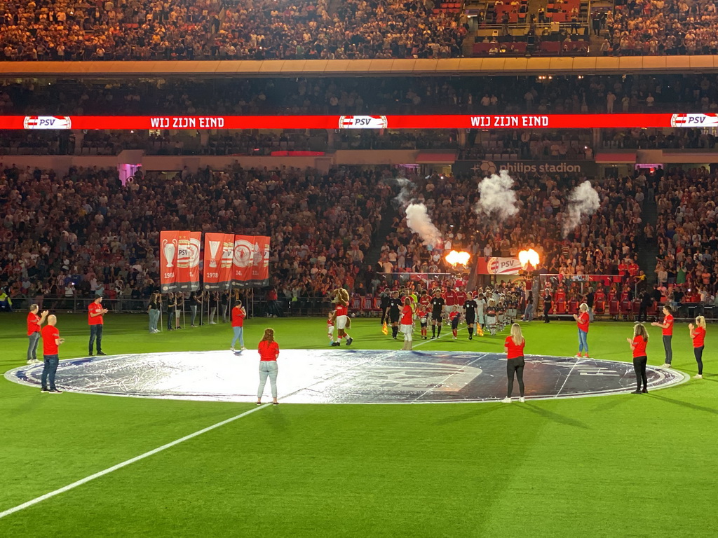 Referees and players entering the pitch at the Philips Stadium, viewed from the Eretribune Noord grandstand, just before the football match PSV - NEC